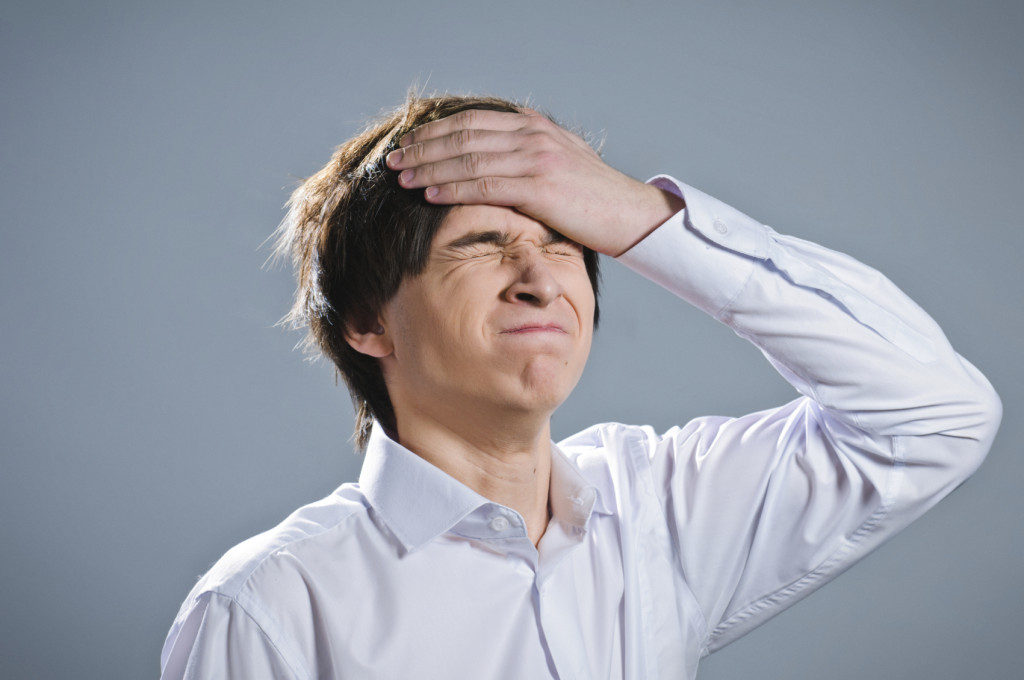 Person with their hand on their head, indicating embarrassment at making a mistake