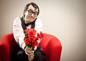 Person holding out a bouquet of roses